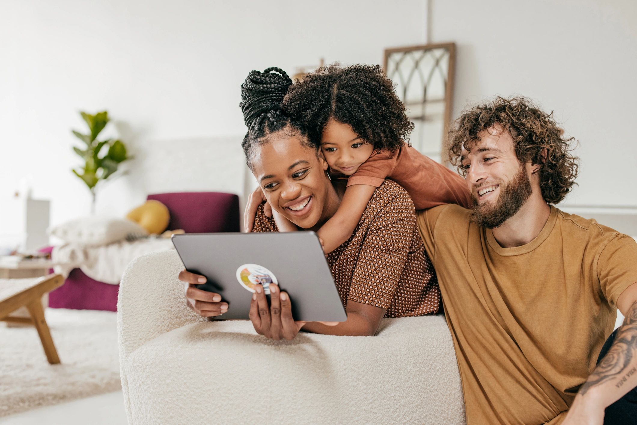 happy family reading newsletter at home